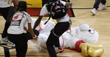 Miami Heat mascot Burnie is dragged off the court after being knocked out by Irish mixed martial artist Conor McGregor during half-time in game four of the NBA Finals between the Denver Nuggets and Miami Heat at Kaseya Center, Miami, US., June 9, 2023. (EPA Photo)