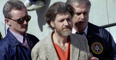 Theodore "Ted" Kaczynski is flanked by federal agents as he is led to a car from the federal courthouse in Helena, Montana, U.S., April 4, 1996. (AP Photo)