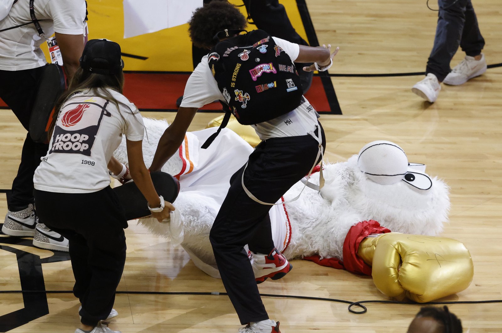 Miami Heat mascot Burnie is dragged off the court after being knocked out by Irish mixed martial artist Conor McGregor during half-time in game four of the NBA Finals between the Denver Nuggets and Miami Heat at Kaseya Center, Miami, US., June 9, 2023. (EPA Photo)