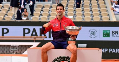 Serbia&#039;s Novak Djokovic poses with his trophy as he celebrates his victory over Norway&#039;s Casper Ruud during their men&#039;s singles final match on day fifteen of the Roland-Garros Open tennis tournament at the Court Philippe-Chatrier, Paris, France, June 11, 2023. (AFP Photo)