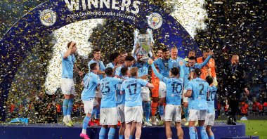 Manchester City&#039;s German midfielder Ilkay Gündoğan holds the European Cup trophy aloft as they celebrate winning the UEFA Champions League final football match between Inter Milan and Manchester City at the Ataturk Olympic Stadium in Istanbul, Türkiye, June 10, 2023. (IHA Photo)
