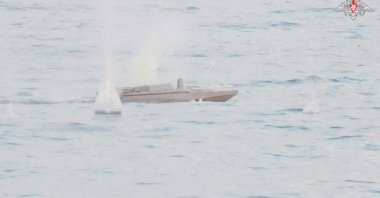 A still image from a video, released by Russia's Defence Ministry, shows what it said to be the Ukrainian drone boat attacking the Russian warship Priazovye in the Black Sea in this image taken from handout footage released June 11, 2023. (Reuters Photo)