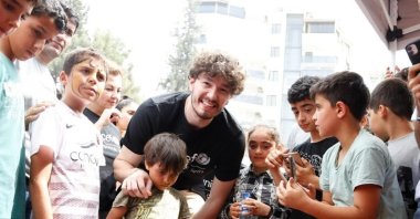 Cleveland Cavaliers&#039; Turkish basketball player Cedi Osman poses for a photo with the children from the Feb. 6 earthquake zones, Antakya, Türkiye, June 10, 2023. (UNICEF on Instagram)