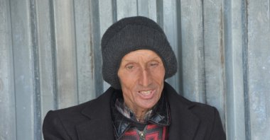 Ecevit Öküzcü, known as "Aşık Ecevit" ("Ecevit in Love"), is seen waiting at the stop in Sinop, Türkiye, June 12, 2023. (IHA Photo)