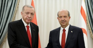 President Recep Tayyip Erdoğan shakes hands with Turkish Republic of Northern Cyprus (TRNC) President Ersin Tatar, in Lefkoşa (Nicosia), TRNC, June 12, 2023. (İHA Photo)