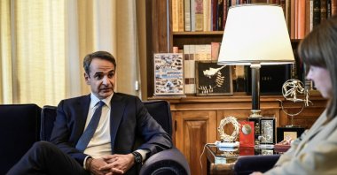 Greek Prime Minister Kyriakos Mitsotakis (L) speaks with Greek President Katerina Sakellaropoulou ahead of their meeting at the Presidential Palace in Athens, on May 22, 2023. (AFP File Photo)