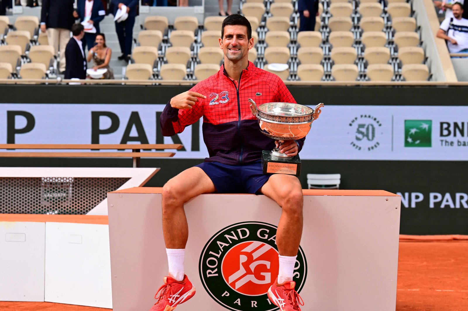 Serbia&#039;s Novak Djokovic poses with his trophy as he celebrates his victory over Norway&#039;s Casper Ruud during their men&#039;s singles final match on day fifteen of the Roland-Garros Open tennis tournament at the Court Philippe-Chatrier, Paris, France, June 11, 2023. (AFP Photo)