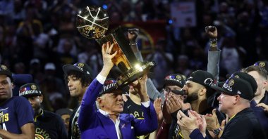 Denver Nuggets owner Stan Kroenke raises the Larry O&#039;Brien Championship Trophy after a 94-89 victory against the Miami Heat in Game Five of the 2023 NBA Finals to win the NBA Championship at Ball Arena, Denver, U.S., June 12, 2023. (AFP Photo)