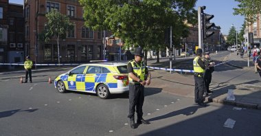 Police officers block a road in Nottingham, Britain, Tuesday, June 13, 2023. (AP Photo)