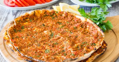 Lahmacun, a very thin Turkish bread covered with seasoned minced meat and onion. (Shutterstock Photo)