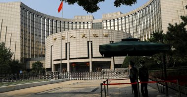 Paramilitary police officers stand guard in front of the headquarters of the People's Bank of China (PBOC), Beijing, China, Sept. 30, 2022. (Reuters Photo)