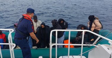 Turkish coast guard officers assist migrants pushed back to Turkish waters, in Ayvalık, Balıkesir, western Türkiye, June 13, 2023. (İHA Photo)