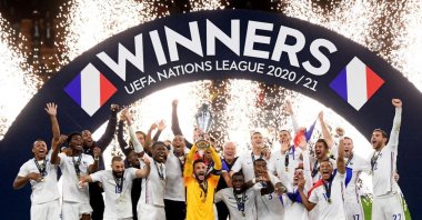 France's Hugo Lloris lifts the trophy as they celebrate after winning the Nations League final against Spain at the San Siro, Milan, Italy, Oct. 10, 2021. (Reuters Photo)