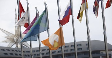 The orange flag representing food-waste awareness is waving along with other flags, Antalya, southern Türkiye, June 14, 2023. (AA Photo)