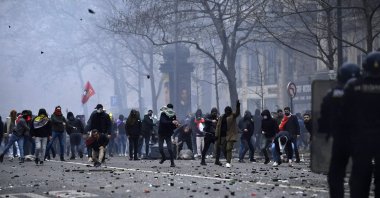 PKK terror group supporters face riot police as clashes erupt, in Paris, France, Dec. 24, 2022. (AFP Photo)