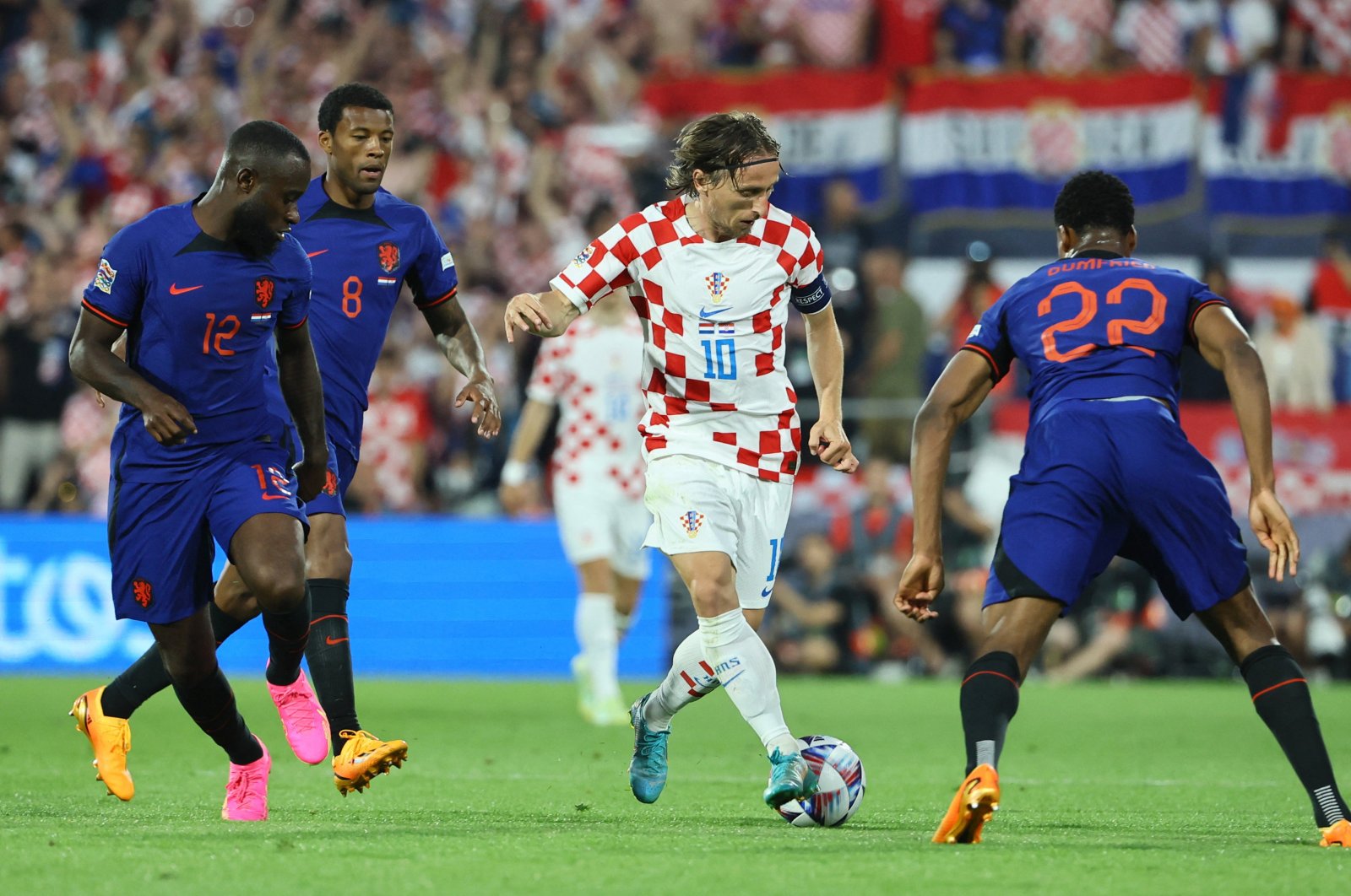Croatia&#039;s Luka Modric (C) in action with Netherlands&#039; Denzel Dumfries (R) during the UEFA Nations League, semifinal match at the Feyenoord Stadium, Rotterdam, Netherlands, June 14, 2023. (Reuters Photo) 
