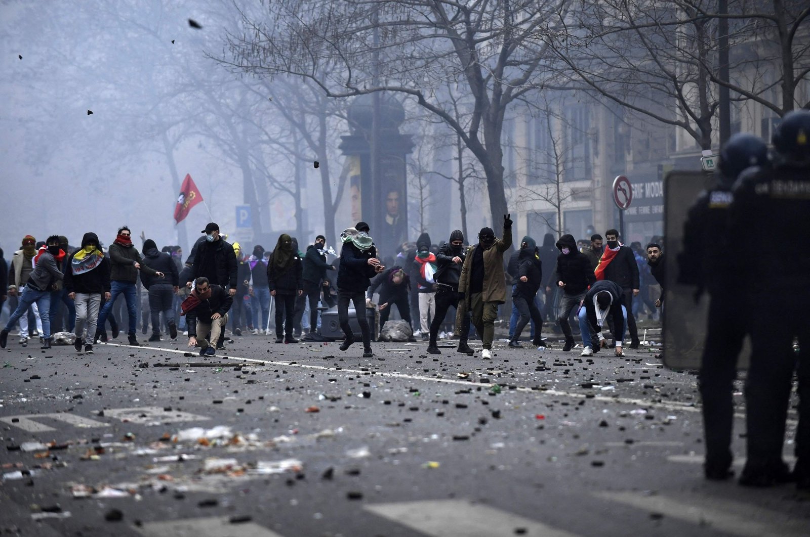 PKK terror group supporters face riot police as clashes erupt, in Paris, France, Dec. 24, 2022. (AFP Photo)