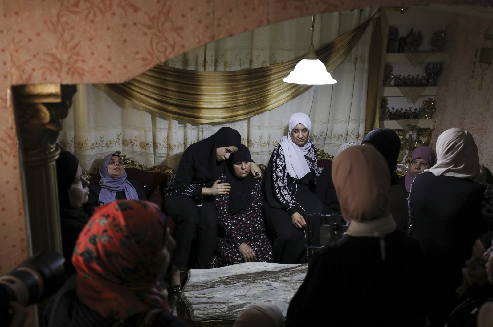 Relatives mourn during the funeral of Khalil Al Anees, at Al-Ain refugee camp, near the occupied West Bank city of Nablus, Palestine, June 15, 2023. (EPA Photo)