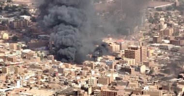 An aerial view of the black smoke and flames at a market in Omdurman, Khartoum North, Sudan, May 17, 2023 in this screengrab obtained from a handout video. VIDEO OBTAINED BY REUTERS/Handout via REUTERS    THIS IMAGE HAS BEEN SUPPLIED BY A THIRD PARTY.