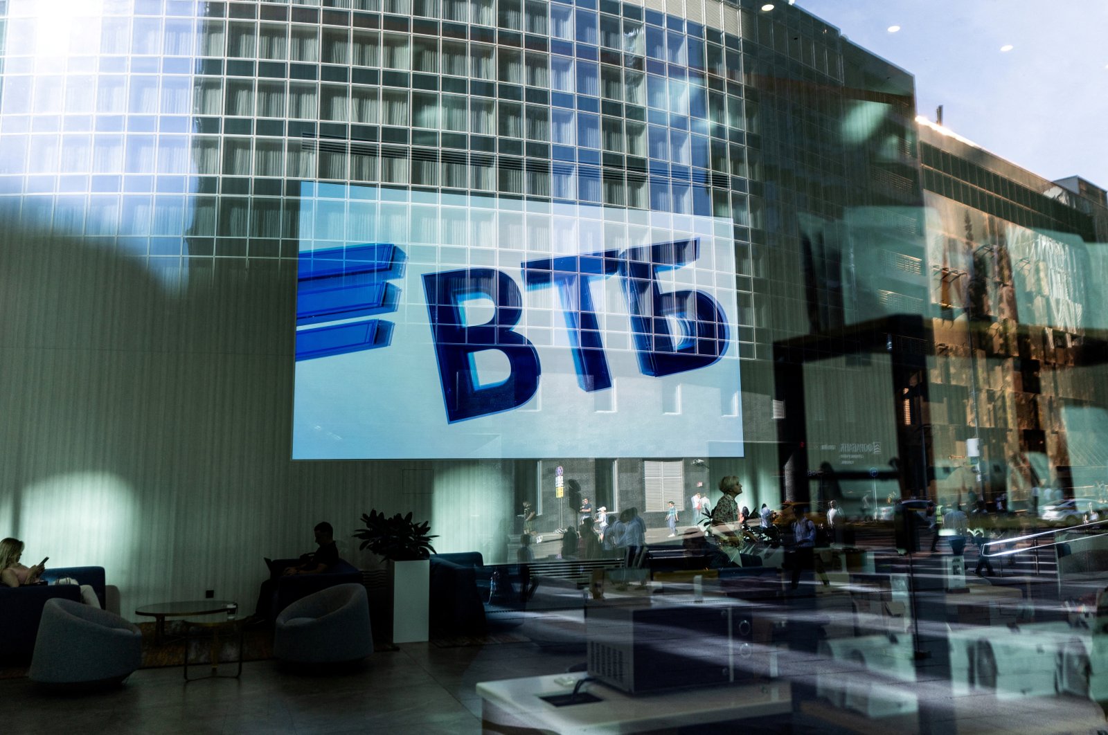 A VTB bank logo is seen on screen through a window in the Moscow International Business Center, also known as Moscow-City, on a sunny day in Moscow, Russia, Aug. 12, 2022. (Reuters Photo)