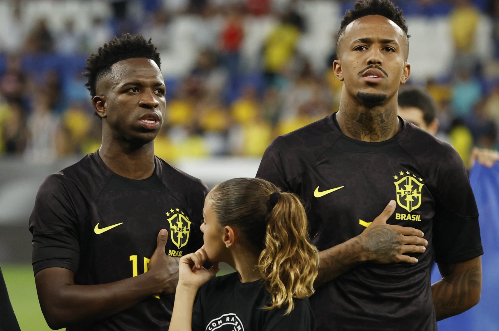 Brazil&#039;s Vinicius Junior (L) and Eder Militao line up before a match against Guinea, Barcelona, Spain, June 17, 2023. (Reuters Photo)