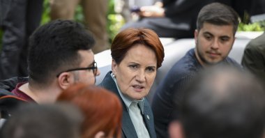 Good Party (IP) Chairperson Meral Akşener chats with a group of youths at a cafe as part of the election campaign in Istanbul, Türkiye, May 24, 2023. (AA Photo)