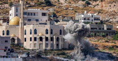Smoke billows from an Israeli rocket's impact explosion during an army raid in Jenin in the occupied West Bank, Palestine, June 19, 2023. (AFP Photo)