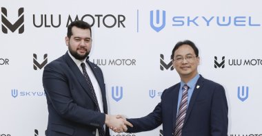 Skywell Türkiye CEO Mahmut Ulubaş (L) and Wu Longba, co-founder and CEO of Skywell, shake hands in this photo provided on June 19, 2023. (AA Photo)