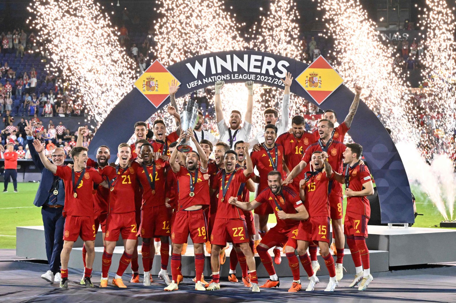 Spain&#039;s players celebrate on the podium with the UEFA Nations League cup after winning the penalty shootouts and the UEFA Nations League final football match between Croatia and Spain at the De Kuip Stadium, Rotterdam, Netherlands, June 18, 2023. (AFP Photo)