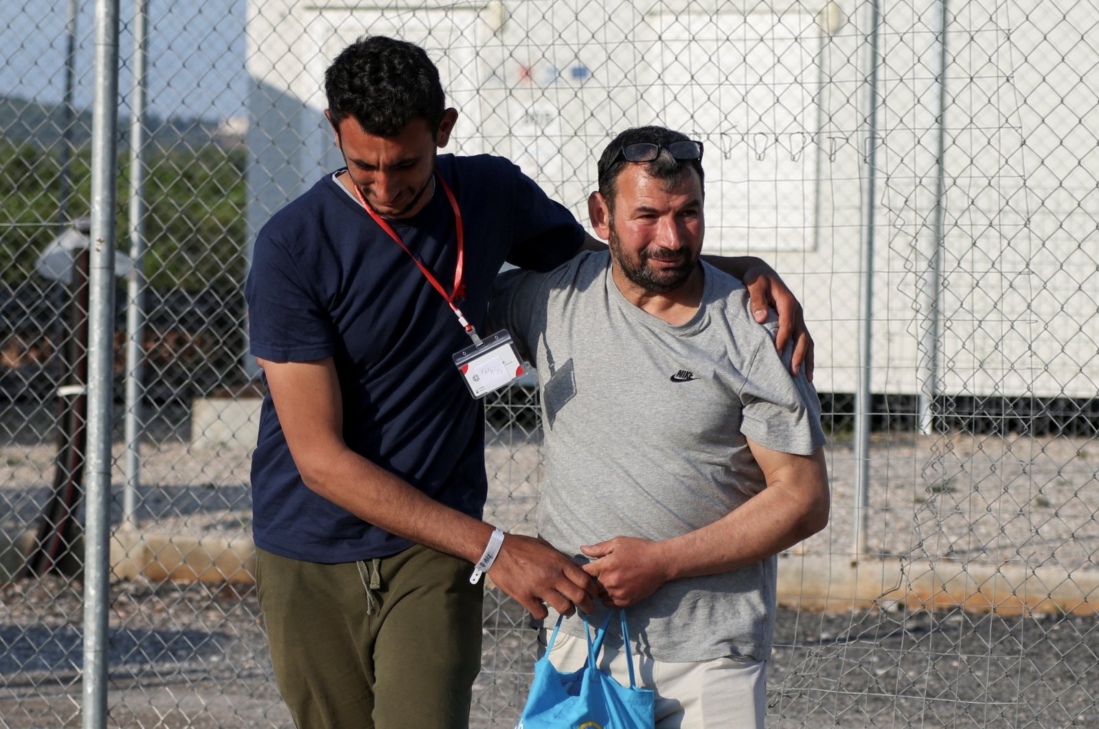 Egyptian survivor Atia Al Said (L), 22, reunites with his uncle Mohamed el Sayed el-Dadamony Radwan, 54, inside a reception and identification camp in Malakasa, Greece, June 18, 2023. (Reuters Photo)