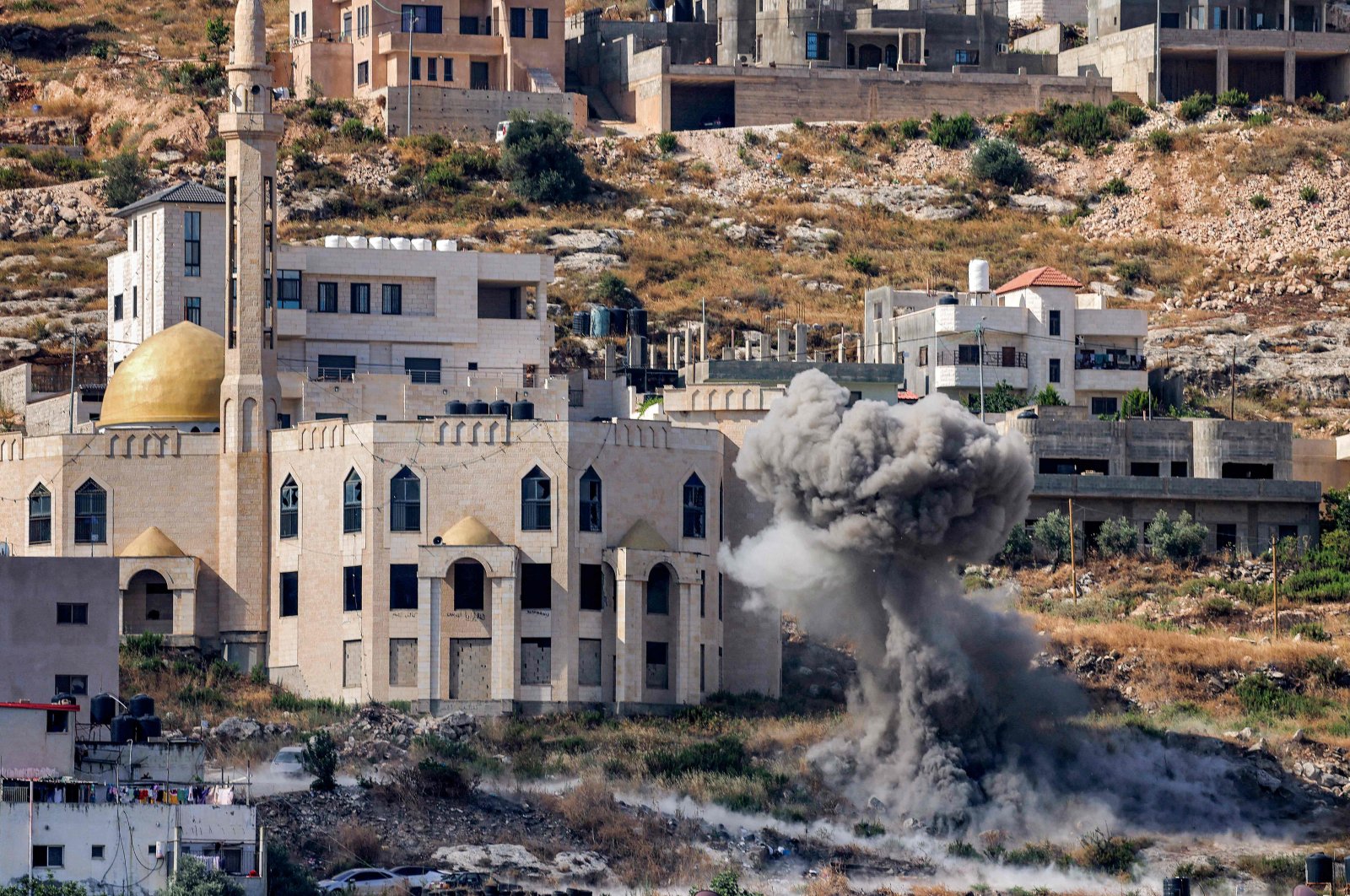 Smoke billows from an Israeli rocket&#039;s impact explosion during an army raid in Jenin in the occupied West Bank, Palestine, June 19, 2023. (AFP Photo)