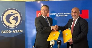 Representative of the Taipei Economic and Cultural Mission in Ankara Volkan Chih-Yang Huang (L) shakes hands with SGDD-ASAM General Coordinator Ibrahim Vurgun Kavlak on facilitating education in the earthquake region, Ankara, Türkiye, June 19, 2023. (AA Photo)