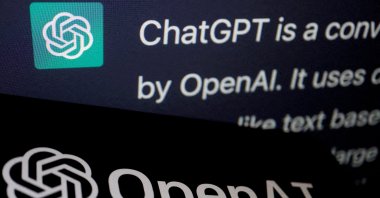 The logo of OpenAI is displayed near a response by its AI chatbot ChatGPT on its website, in this illustration picture taken Feb. 9, 2023. (Reuters Photo)