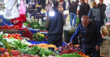 A man looks at produce at a market, in Ankara, Türkiye, May 27, 2023. (Reuters Photo)
