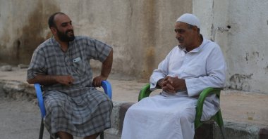 Ahmed Selmo (L) is among the returnees from Türkiye, now settled in Tal Abyad, Syria, June 20, 2023. (AA Photo)