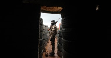 Syrian fighters man positions on the outskirts of the town of Kuljibrin, in the country's northern Aleppo governorate, facing YPG/PKK terrorist positions in Tal Rifaat, Syria, Nov. 25, 2022. (AFP Photo)