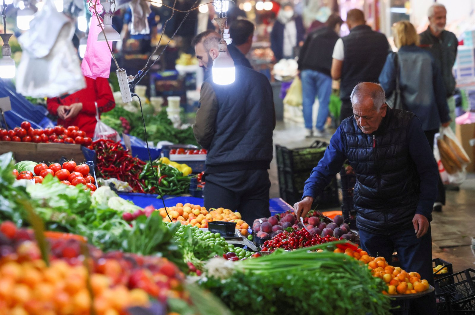 A man looks at produce at a market, in Ankara, Türkiye, May 27, 2023. (Reuters Photo)