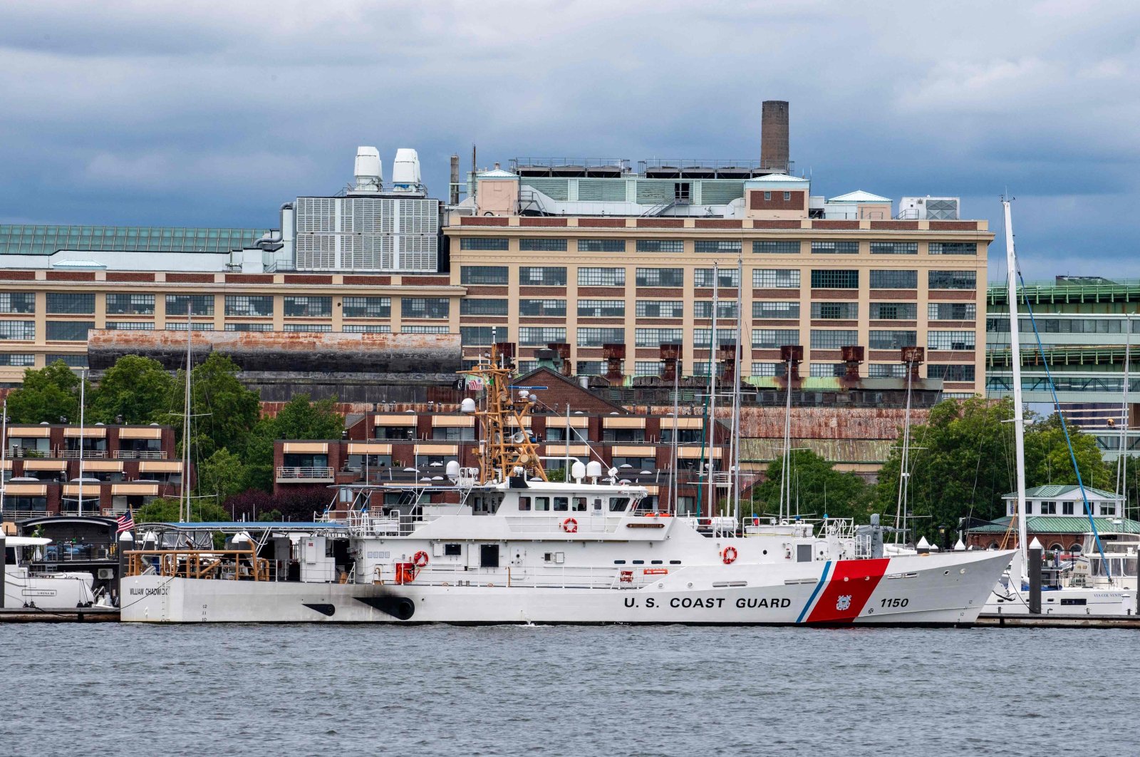 A U.S. Coast Guard vessel sits in port in Boston Harbor across from the US Coast Guard Station Boston in Boston, Massachusetts, June 19, 2022. (AFP Photo)