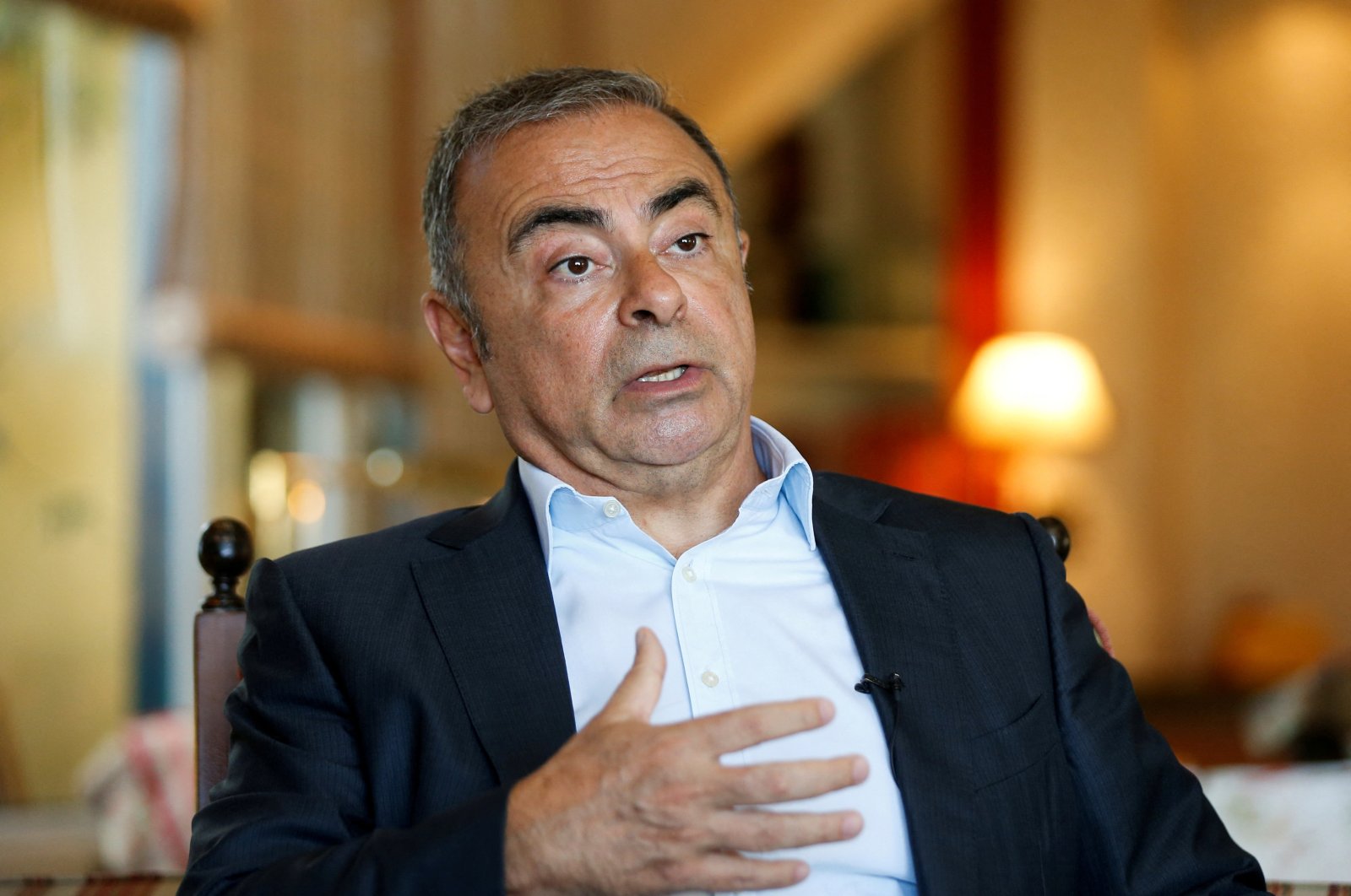 Fugitive former car executive Carlos Ghosn, gestures as he talks during an interview with Reuters in Beirut, Lebanon June 14, 2021. (Reuters File Photo)