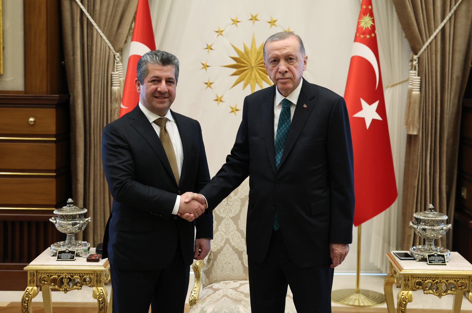 President Recep Tayyip Erdoğan (R) and Kurdish Regional Government (KRG) Prime Minister Masrour Barzani shake hands ahead of a meeting in the capital Ankara, Türkiye, June 20, 2023. (AA Photo)