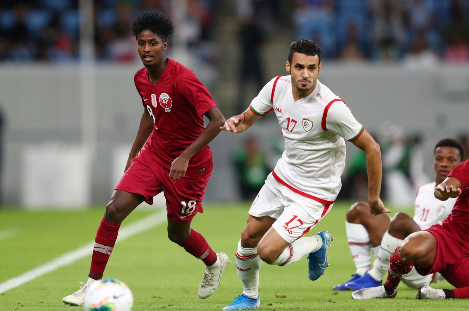  Qatar&#039;s Yusuf Abdurisag in action with Oman&#039;s Ali Al-Busaidi in 2022 World Cup Qualifier Round 2 game at Al Janoub Stadium in Al Wakrah, Qatar, Oct. 15, 2019. (Reuters File Photo)