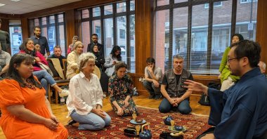 Qayyim Naoki Yamamoto demonstrates the art of the Japanese tea tradition to the participants in an event in Yunus Emre Institute (YEE) London, U.K., June 20, 2023. (Photo courtesy of YEE)
