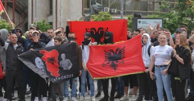 Kosovo Albanians hold Albanian flags take part in a demonstration in the south of Mitrovica, Kosovo, June 1, 2023. (AFP Photo)