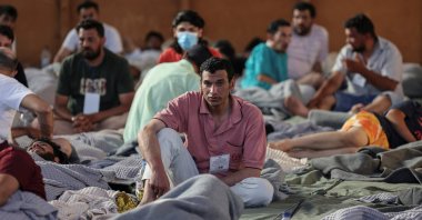 Migrants rest in a shelter, following a rescue operation, after their boat capsized in the open sea, Kalamata, Greece, June 14, 2023. (Reuters Photo)