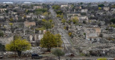 A car moves along a street in the deserted and ruined city, of Aghdam, Azerbaijan, Nov. 19, 2020. (AFP File Photo)