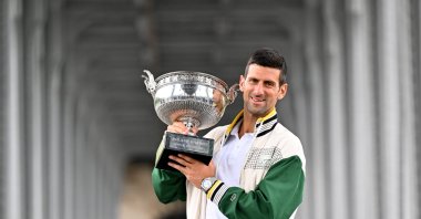 Serbia's Novak Djokovic holds his trophy after winning at the French Open, Paris, France, June 12, 2023. (AA Photo)