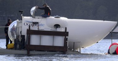 OceanGate CEO Stockton Rush emerges from the hatch atop the OceanGate submarine Cyclops 1 in the San Juan Islands, Wash., on Sept. 12, 2018. (AP File Photo)