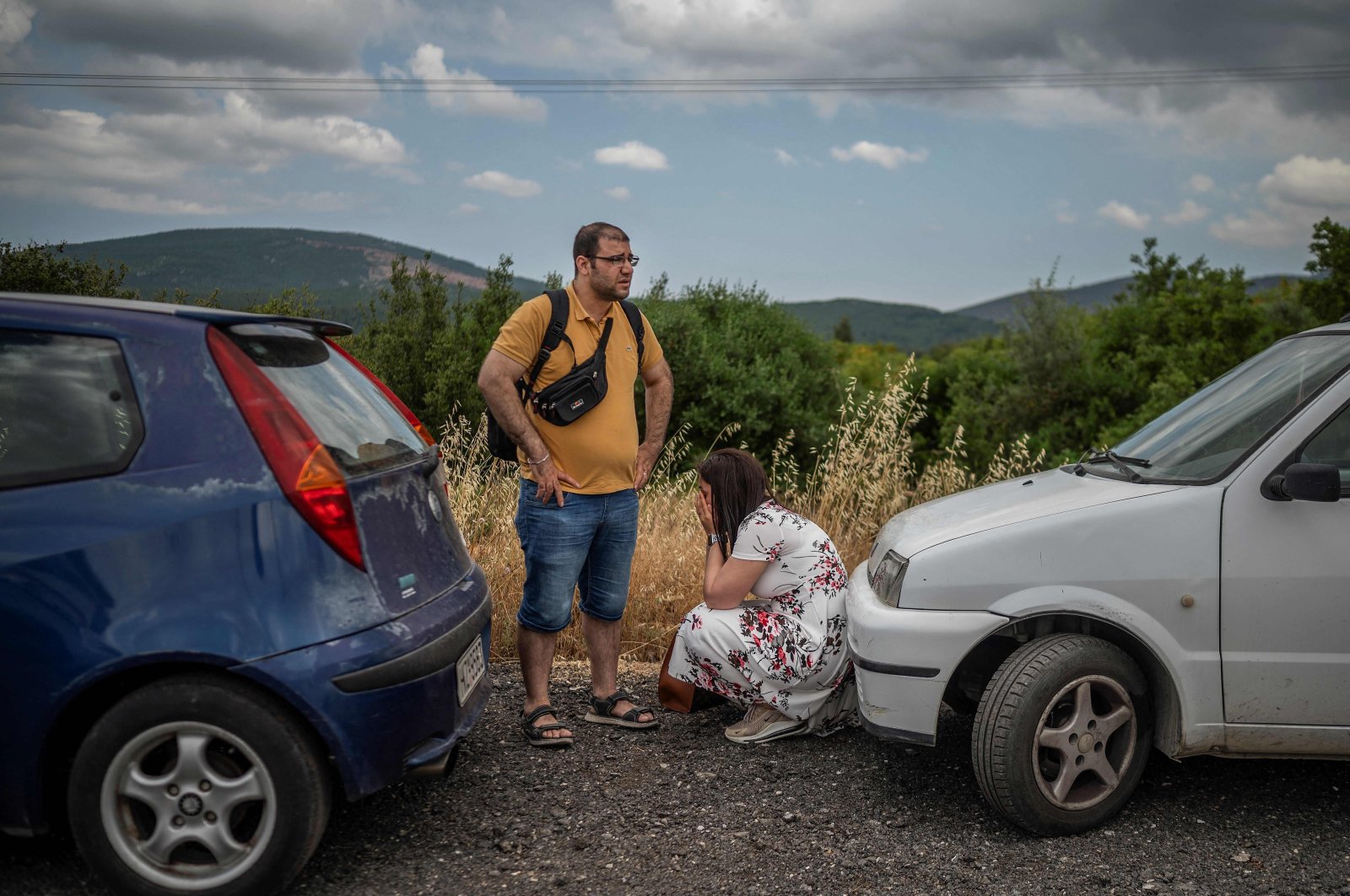 Relatives of wait to meet their relative who survived the shipwreck off the Greek coast wait near a migrant camp in Malakasa, near Athens, Greece, June 16, 2023. (AFP Photo)