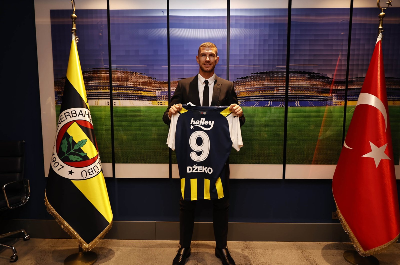 Fenerbahçe&#039;s new striker Edin Dzeko poses for a photo with a jersey after signing a two-year contract with the Turkish club in Istanbul, Türkiye, June 22, 2023. (AA Photo)