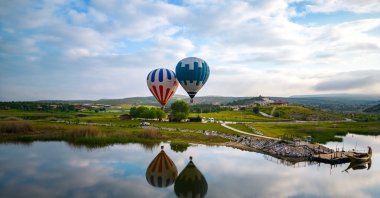 A general view of hot air balloons floating in the Phrygian Valley, Afyonkarahisar, Türkiye, June 22, 2023. (AA Photo)